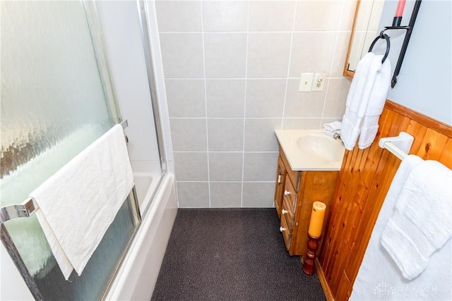 bathroom with shower / bath combination with glass door and vanity