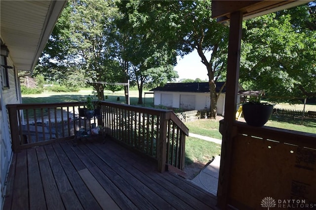 wooden terrace with a lawn