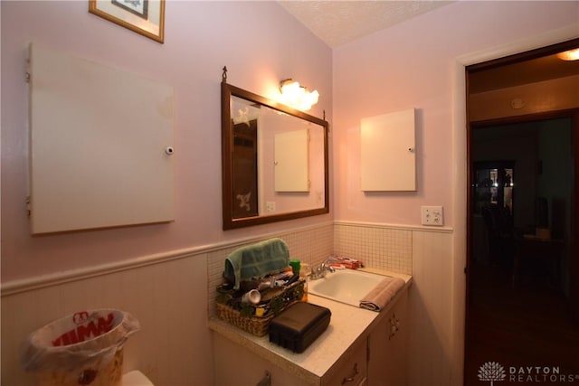 bathroom with vanity and a textured ceiling