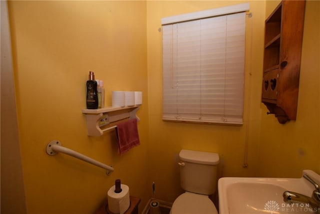 bathroom with sink and toilet