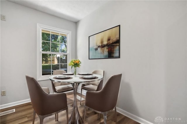 dining area featuring wood-type flooring