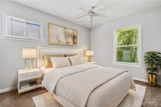 carpeted bedroom with ceiling fan