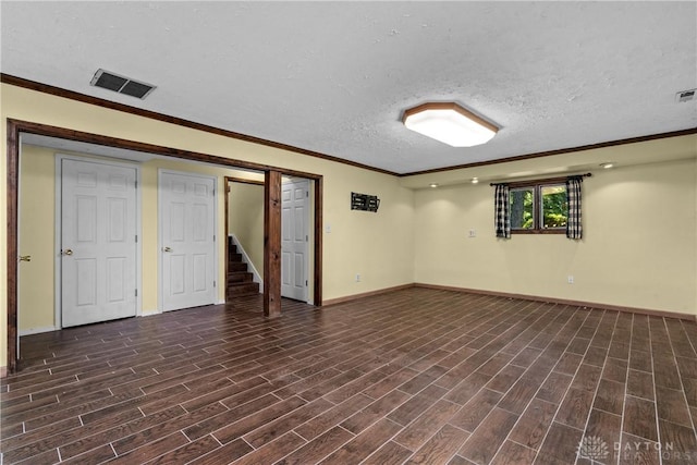 basement with crown molding and a textured ceiling