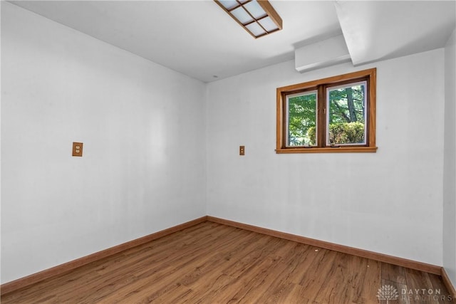 unfurnished room featuring wood-type flooring