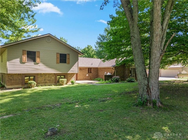 exterior space with a yard and a garage