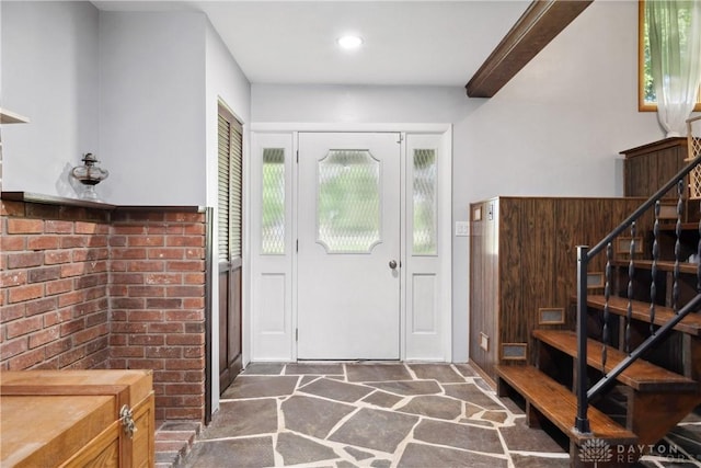 entrance foyer featuring ornamental molding