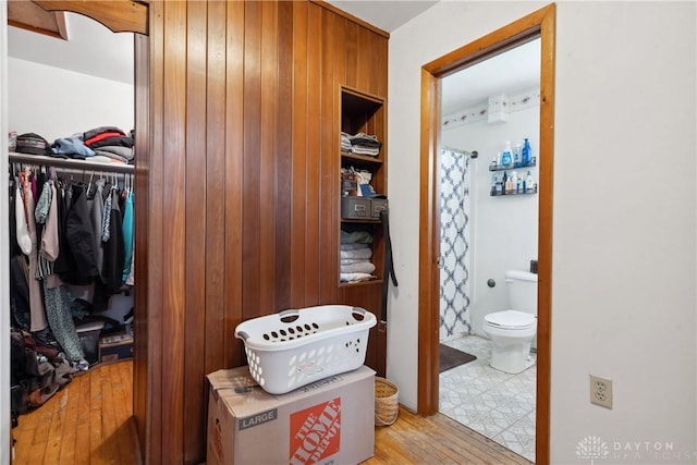 spacious closet featuring light hardwood / wood-style flooring