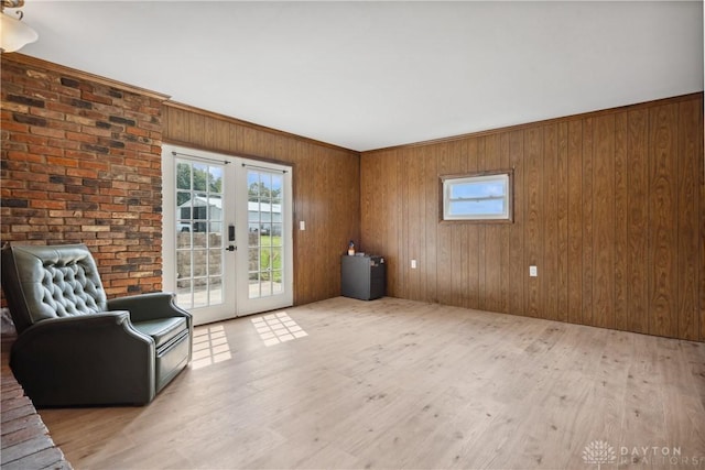 unfurnished room featuring french doors and light hardwood / wood-style floors