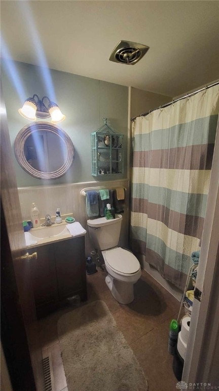 bathroom featuring vanity, a shower with curtain, tile patterned floors, and toilet