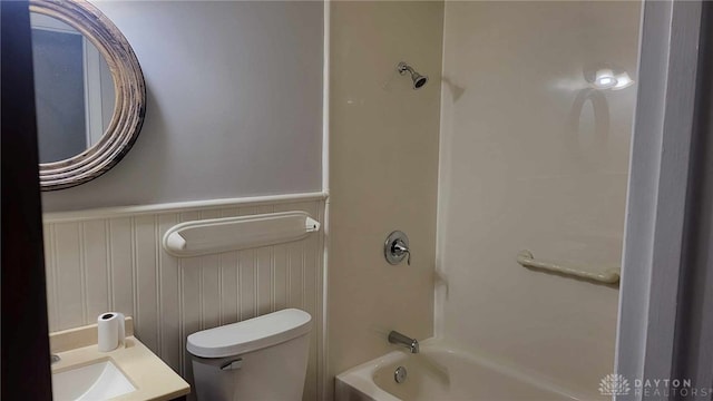 full bathroom featuring  shower combination, toilet, and vanity