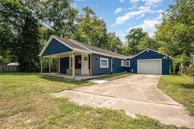 ranch-style house featuring a garage, covered porch, and a front yard