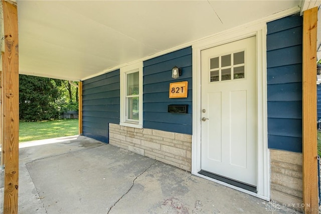 doorway to property featuring a porch