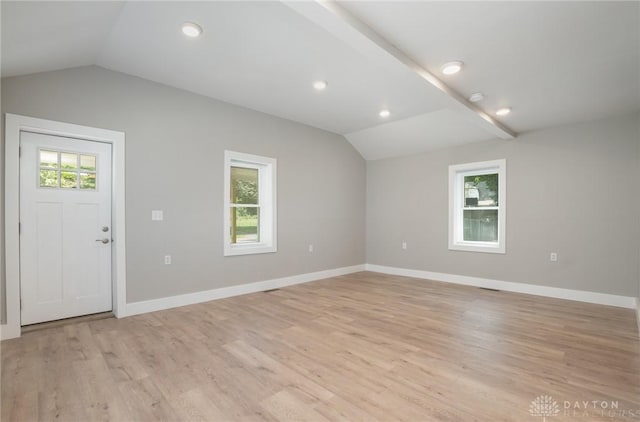 foyer featuring light hardwood / wood-style flooring and vaulted ceiling