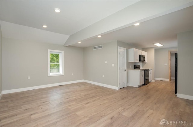 unfurnished living room with light wood-type flooring