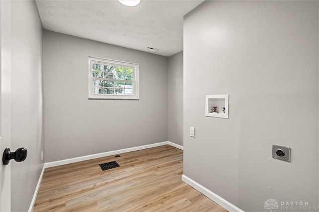 laundry room with hookup for a washing machine, laundry area, electric dryer hookup, and baseboards