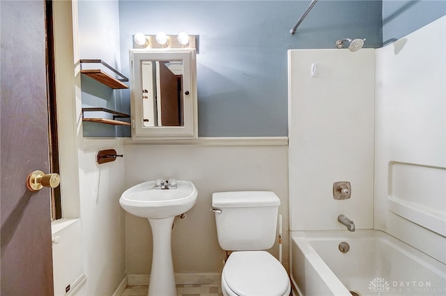 bathroom featuring shower / bath combination and toilet