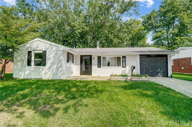 ranch-style home with a garage and a front lawn