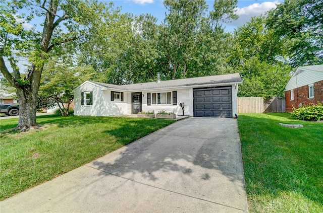 single story home featuring a garage and a front lawn