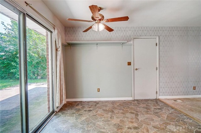 empty room featuring light tile patterned flooring and ceiling fan