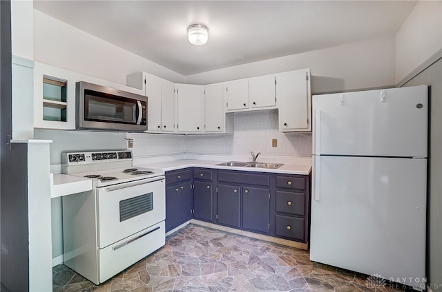 kitchen featuring tile patterned flooring, white cabinetry, white appliances, blue cabinetry, and sink