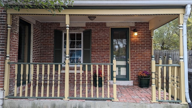 entrance to property featuring a porch