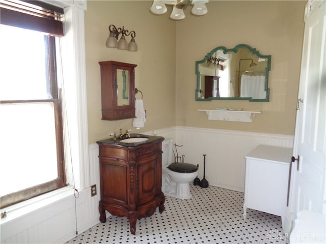 bathroom with a bidet, plenty of natural light, and vanity