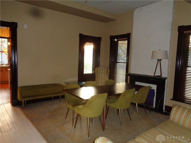 dining space with light hardwood / wood-style flooring