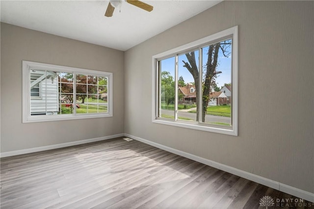 spare room with ceiling fan and light hardwood / wood-style flooring