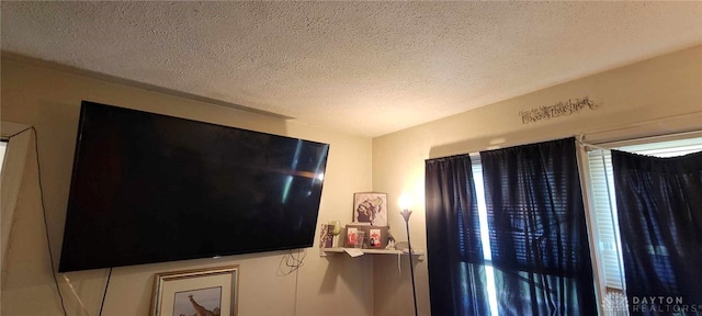 interior details featuring a textured ceiling