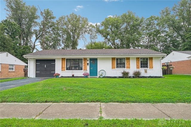 single story home with a garage and a front yard