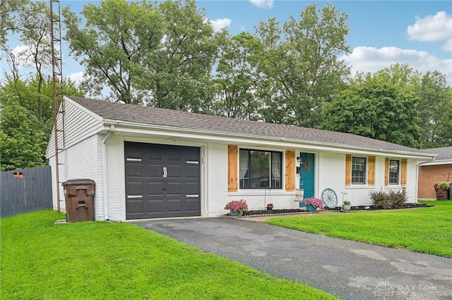 ranch-style home with a garage and a front yard