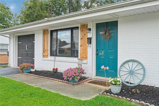 entrance to property with a porch and a garage