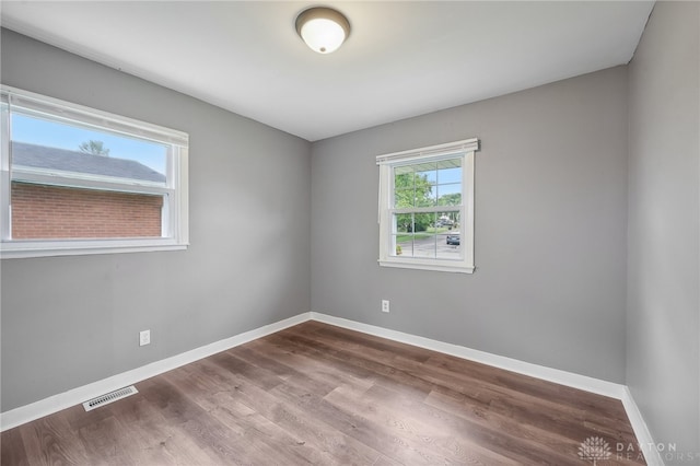 unfurnished room featuring wood-type flooring