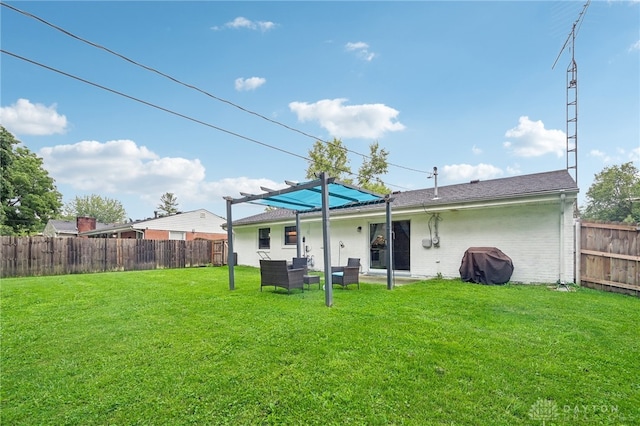 back of property with a patio and a yard