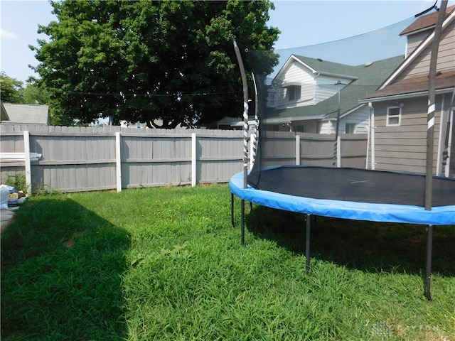 view of yard with a trampoline