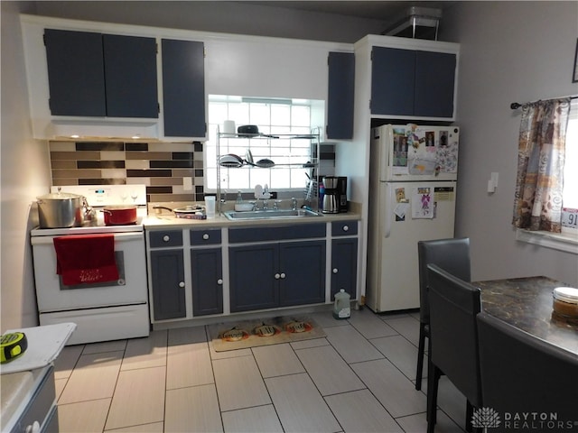 kitchen with white appliances, sink, exhaust hood, light tile patterned floors, and backsplash