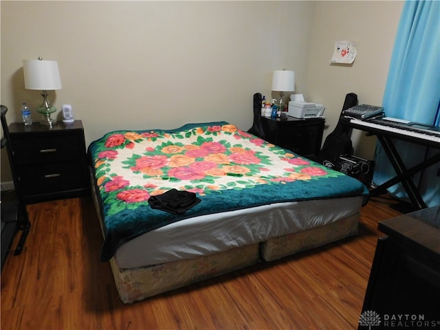 bedroom featuring hardwood / wood-style floors