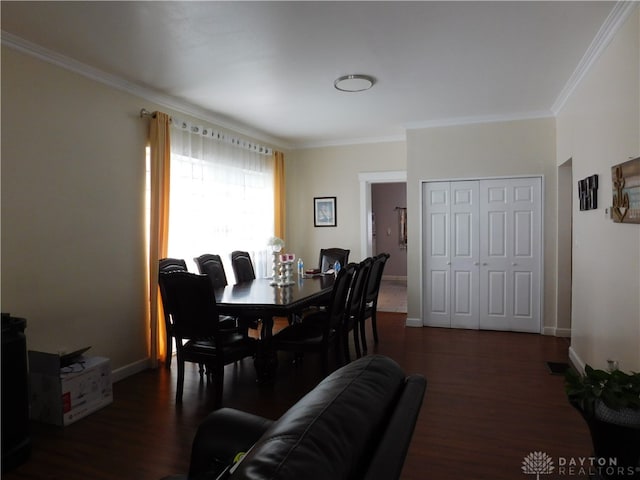 dining room featuring dark hardwood / wood-style flooring and ornamental molding