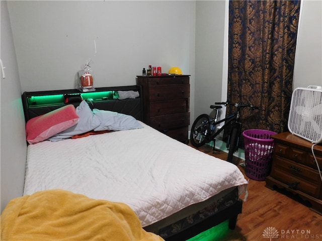 bedroom with wood-type flooring