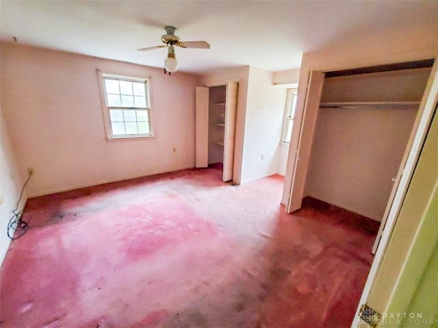 unfurnished bedroom featuring light carpet, a closet, and ceiling fan