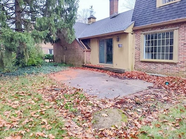 doorway to property with a patio area