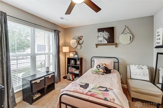 carpeted bedroom featuring ceiling fan