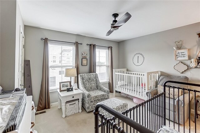 carpeted bedroom featuring ceiling fan