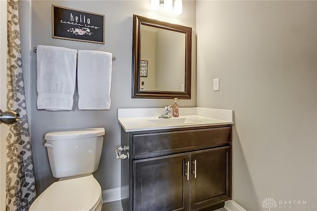 bathroom featuring vanity and toilet