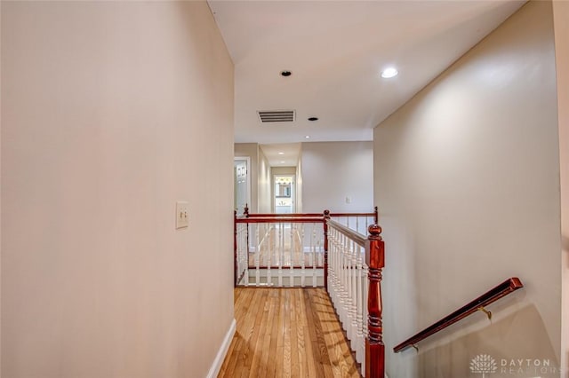 corridor with light wood-type flooring