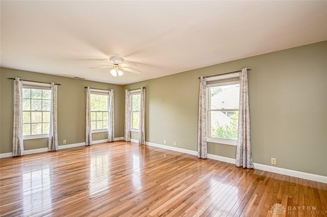 spare room featuring ceiling fan and light hardwood / wood-style flooring