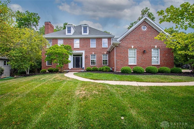 colonial inspired home with a front yard