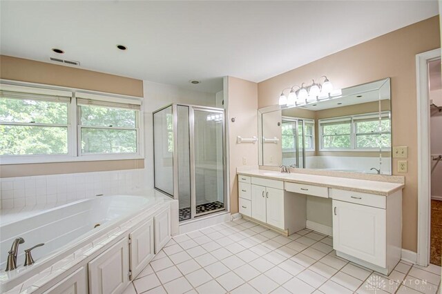 bathroom featuring vanity, separate shower and tub, tile patterned flooring, and plenty of natural light