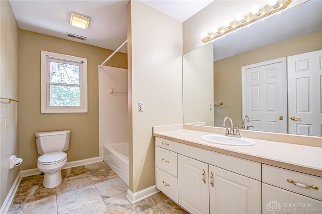 full bathroom with tile patterned floors, vanity, tiled shower / bath combo, and toilet