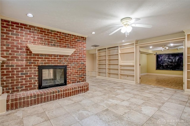 unfurnished living room with light tile patterned flooring, brick wall, a fireplace, and ceiling fan